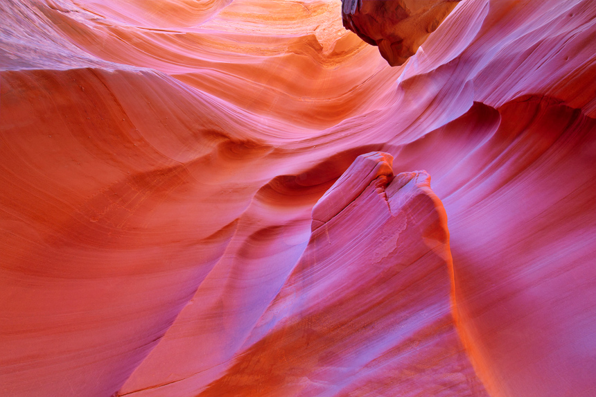 photograph of a pink, yellow, and orange sandstone wall in arizona